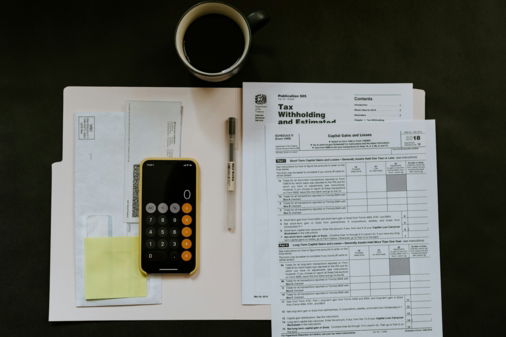 black-android-smartphone-near-ballpoint-pen--tax-withholding-certificate-on-top-of-white-folder.jpg black Android smartphone near ballpoint pen, tax withholding certificate on top of white folder